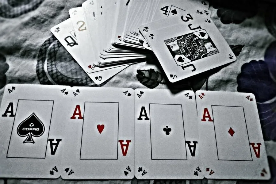 Four aces laid out on a table